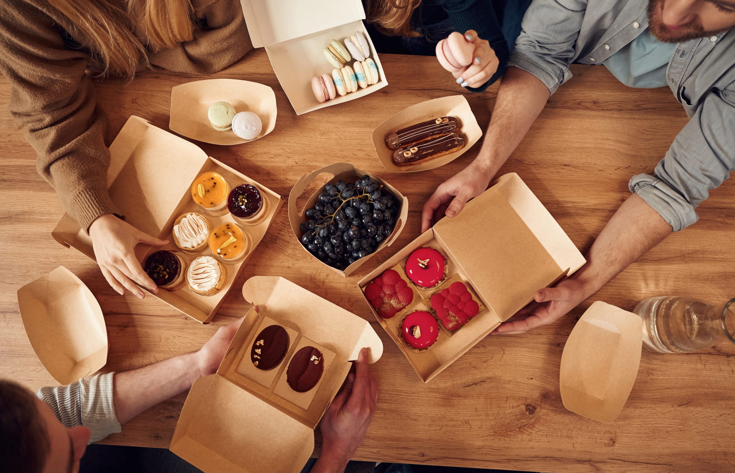 top view of table with food on it hands of the pe 2026 01 08 23 35 44 utc (1)